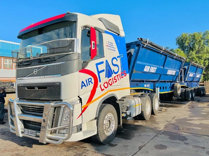 Volvo FH truck with blue Air Fast side-tipper trailer