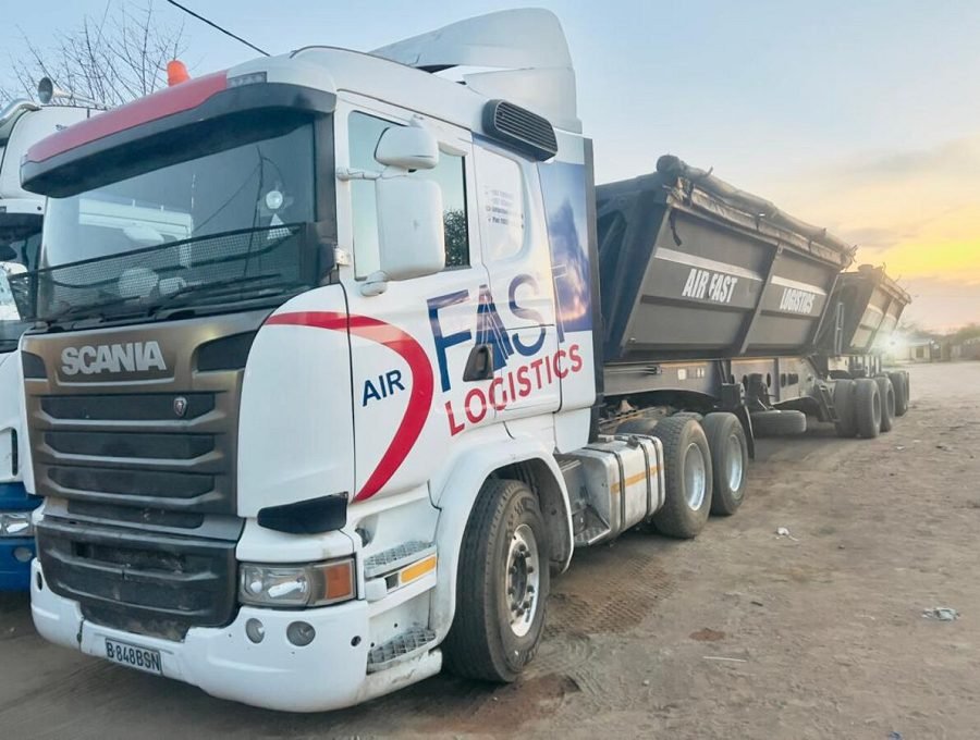 Air Fast Logistics Scania truck with side-tipper trailer at sunset