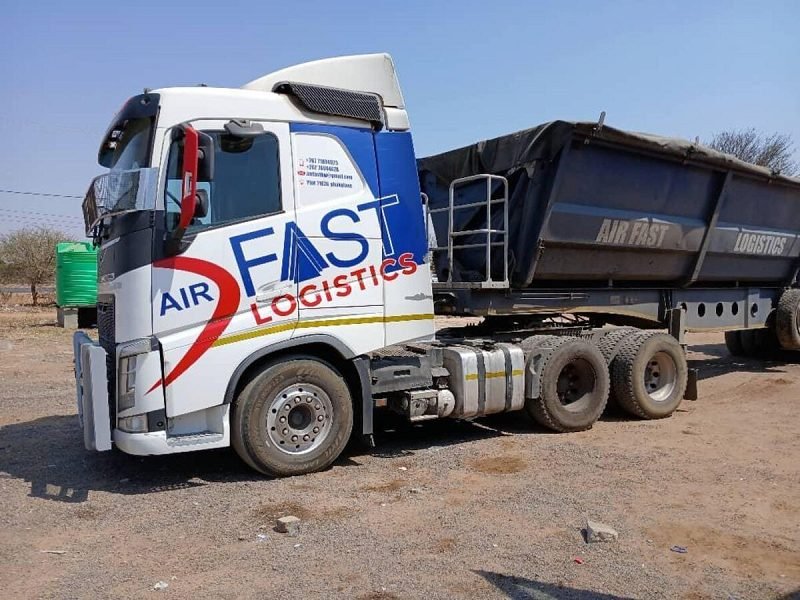 Volvo truck coupled to a side-tipper trailer