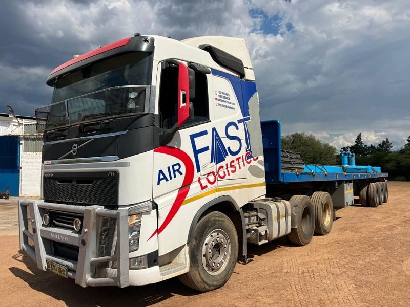 Volvo truck with a flat-deck trailer